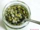 Dishes with marinated capers and olives