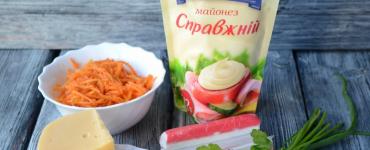 Layered salad with Korean carrots and crab sticks with cheese